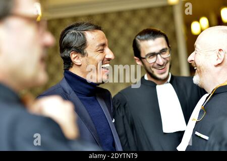 L'ancien avocat français Karim Achoui, flanqué de ses avocats, arrive au palais de justice pour le premier jour du procès des six hommes, membres du crime organisé, qui auraient tenté sa vie en 2007, à Paris, en France, le 17 septembre 2013. Photo de Mousse/ABACAPRESS.COM Banque D'Images