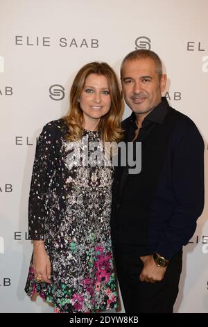 Le designer libanais Elie Saab pose avec son épouse Claudine après son salon de collection Printemps-été 2014 prêt-à-porter qui s'est tenu à l'espace Tuileries à Paris, en France, le 30 septembre 2013. Photo par Ammar Abd Rabbo/ABACAPRESS.COM Banque D'Images