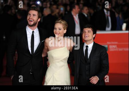 Liam Hemsworth, Jennifer Lawrence et Josh Hutcherson assistent à la première du film The Hunger Games: Hunger Fire dans le cadre du 8e Festival du film de Rome, en Italie, le 14 novembre 2013. Photo par Eric Vandeville/ABACAPRESS.COM Banque D'Images