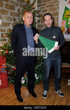 Patrick Poivre d'Arvor, Marc-Emmanuel Dufour participant au lancement de la campagne du secours populaire « les Peres Noel Verts » au siège de l'association à Paris, en France, le 02 décembre 2013. Photo d'Alban Wyters/ABACAPRESS.COM Banque D'Images