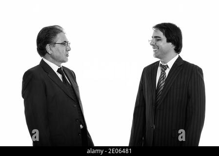 Voir le profil de professionnels jeunes et senior Persian businessman smiling Banque D'Images