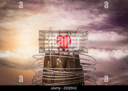 Cœur rouge dans une cage au sommet d'une montagne au coucher du soleil par jour magenta. Cœur rouge est prisonnier dans une cage métallique ou pas de liberté. illustration 3d Banque D'Images