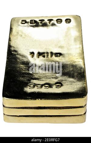 trois lingots d'or de 1 kg isolés sur fond blanc Banque D'Images