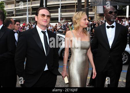 (G-D) Benoit Magimel, Diane Kruger et Djimon Hounsou arrivent pour la projection de la « beauté rampante » présentée en compétition dans la section des longs métrages dans le cadre du 64ème Festival International du film de Cannes, au Palais des Festivals de Cannes, dans le sud de la France, le 12 mai 2011. Photo de Hahn-Nebinger-Genin/ABACAPRESS.COM Banque D'Images