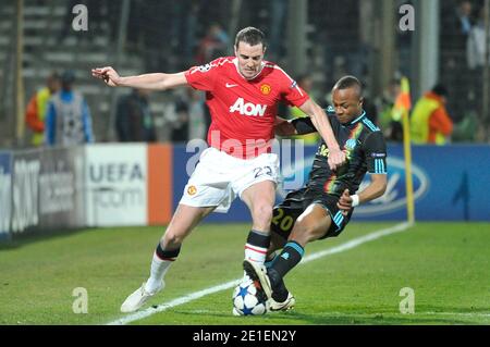 André Ayew de Marseille et John O'Shea de Man Utd lors du match de la Ligue des champions entre l'Olympique de Marseille et le Manchester United FC au Stade vélodrome le 23 février 2011 à Marseille, France. Photo de Stephane Reix/ABACAPRESS.COM Banque D'Images