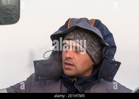 Conducteur du manipulateur hydraulique sur le lieu de travail Banque D'Images