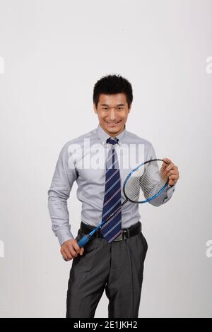 Un exercice d'affaires avec l'homme jouant au badminton photo de haute qualité Banque D'Images