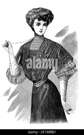 Dames Fashion 1907, longues et élégantes lignes avec corset pour obtenir une silhouette étroite, la poitrine complète et les hanches courbes, complété par la coiffure Gibson fille Banque D'Images