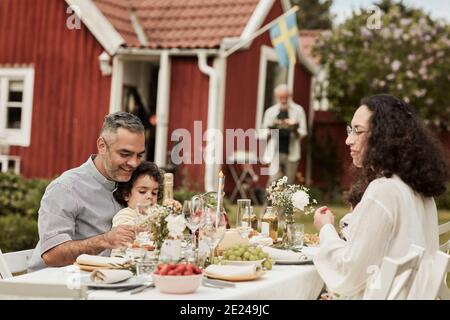 Family having meal in garden