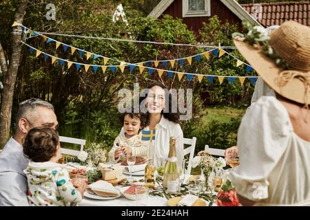 Family having meal in garden