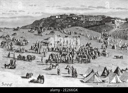 Village de BOGHARI et marché du désert, Qasr el-Boukhari. Algérie. Afrique du Nord. Ancienne illustration de la gravure du livre Nueva Geografia Universal par Eliseo Reclus 1889 Banque D'Images