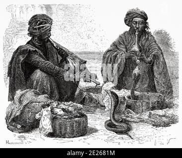 Portrait des charmers de serpent, Inde. Ancienne illustration de gravure d'El Mundo en la Mano 1878 Banque D'Images