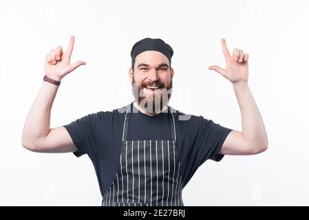 Photo d'un chef barbu souriant. Banque D'Images