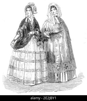 Paris et Londres Fashions pour décembre 1845. 'Une robe en peau de Pekin brun, à rayures en velours. Un manteau en satin émeraude et ouaté richement brodé, avec des fixations gimp à l'avant du manteau. Un capot en soie légère avec une seule plume, et taillé avec une large dentelle pour remplacer le voile. Robe de satin lavande avec trois larges tresses de dentelle noire, chacune dirigée par trois rangées de velours noir étroit, la fleur coupée de la même manière; manches serrées, également taillées au poignet avec du velours noir, et bordé d'une rangée de dentelle profonde, tombant sur la main. Un manteau de mantelet en velours noir surrou Banque D'Images