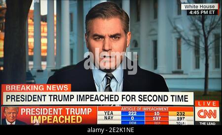 Une capture d'écran de CNN montre le correspondant de la Maison Blanche Jim Acosta en réaction à la deuxième destitution du président américain Donald Trump. Banque D'Images