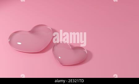 Couple de coeurs en verre transparent sur fond rose. Symbole d'amour pour le mariage ou la Saint-Valentin. Banque D'Images