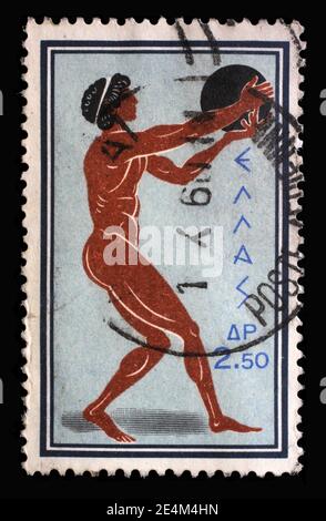 Timbre imprimé en Grèce à partir du numéro des Jeux Olympiques de Rome montre Discus Throw, vers 1960. Banque D'Images