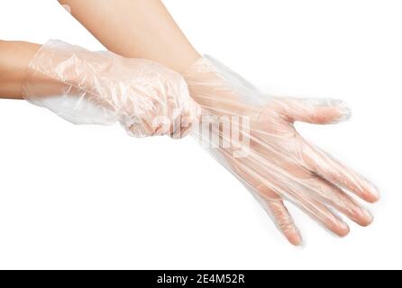 les mains des femmes dans des gants jetables transparents, isoler sur un fond blanc Banque D'Images
