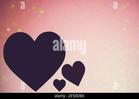 Concept et arrière-plan de la Saint-Valentin. Silhouette de coeur formes isolées sur fond bokeh rose. Banque D'Images