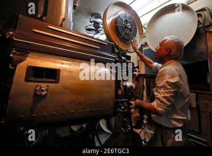 Jagivan Vitaldas Maru 60 Chief Projectionist Of Maratha Mandir Theatre Works Inside The Projection Room During The Screening Of Bollywood Movie Dilwale Dulhania Le Jayenge The Big Hearted Will Take The Bride