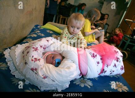 Nadia Khalina Possibly The World S Fattest Baby Lies In A Pram With Her Mother Tatyana L Father Viktor R And Her Siblings In Their Apartment In The Siberian City Of Aleisk October