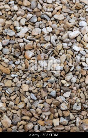 Gros plan du gravier Cerney Shingle à vendre à a Builders Merchants en Angleterre, au Royaume-Uni Banque D'Images