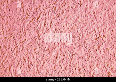 Texture granuleuse abstraite sur paroi rose. Élément de conception et arrière-plan Banque D'Images