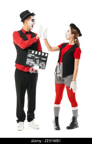 Pantomimistes avec le film clapper sur fond blanc Banque D'Images