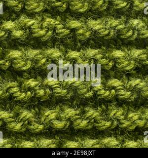 Tissu tricoté vert sans couture pour un garnissage sans bordure. Tissu tricoté à motif répétitif pour un gros plan sur l'arrière-plan. Banque D'Images