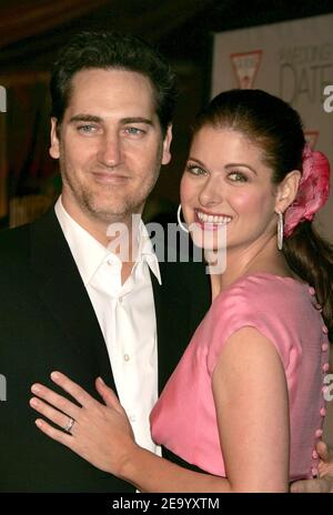 Debra Messing et son mari Daniel Zelman assistent à la première de la date de mariage d'Universal Pictures qui s'est tenue aux cinémas Universal Studios à Universal City, en Californie, le 27 janvier 2005. Photo de Baxter/ABACA Banque D'Images