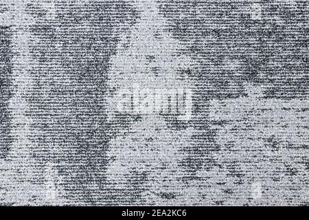 Détail d'un tapis gris à deux tons avec lignes horizontales et motif abstrait. Banque D'Images