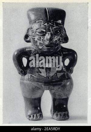 Art mexicain.Figurine fémine nue,polychrome.motifs géométriques en noir et blanc sur Fond rouge.mains sur la céinture.Terre ocre.dite Banque D'Images