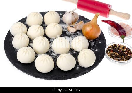 Boulettes congelées avec garniture pour la cuisson. Studio photo Banque D'Images