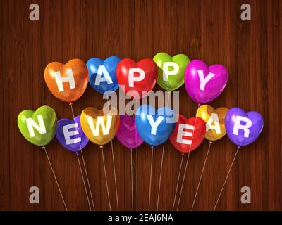 Ballons d'air colorés en forme de coeur pour la nouvelle année sur un arrière-plan en bois sombre Banque D'Images