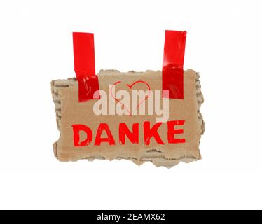 Merci en allemand sur carton marron avec adhésif bande Banque D'Images