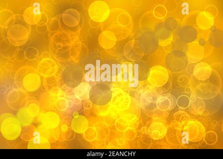 Un résumé festif délicat dégradé de couleur orange jaune doré avec des cercles de bokeh scintillants et brillants. Concept de carte pour le nouvel an heureux, l'invitation à la fête, la Saint-Valentin ou d'autres vacances. Banque D'Images