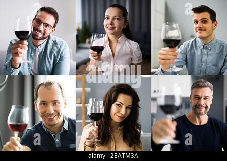 Homme Drinking Red Wine dans la vidéoconférence Banque D'Images