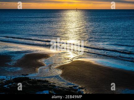 Coucher de soleil sur Maryport avec vue sur la mer Banque D'Images