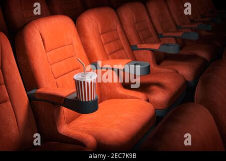 Fond du concept de cinéma. Places de cinéma rouge et cola dans un théâtre vide. illustration 3d Banque D'Images