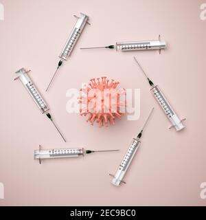 Vaccination de masse contre le concept Covid-19 : plusieurs seringues disposées autour d'un modèle de virus du COV-SRAS-2. Banque D'Images