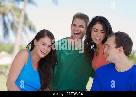 Close-up of two young couples smiling Banque D'Images