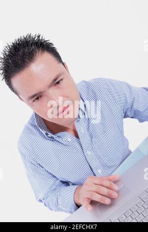 Mid adult man using a laptop Banque D'Images