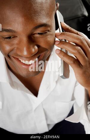 High angle view of a young man using a mobile phone Banque D'Images