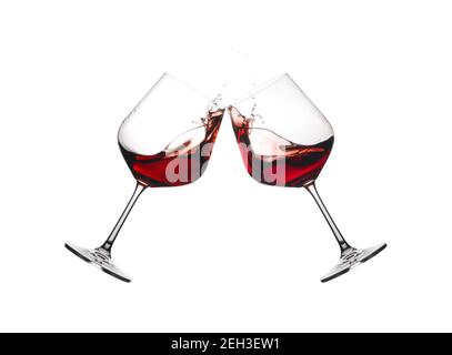 Deux verres à vin en toast avec éclaboussures isolées sur fond blanc. Banque D'Images