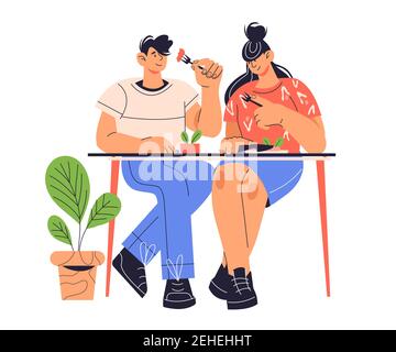 Jeune couple assis à la table et à la salle à manger, dessin animé plat vecteur illustration isolée sur fond blanc. Date au restaurant. Les gens qui déjeunent le Illustration de Vecteur