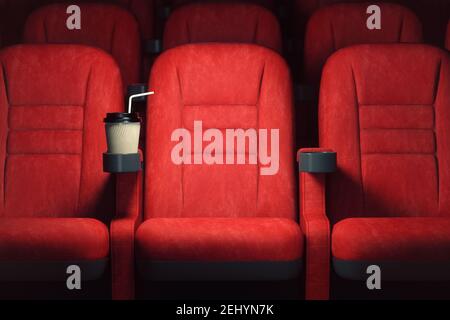 Fond du concept de cinéma. Sièges de cinéma rouge et tasse de papier de café ou de cola dans le théâtre vide. illustration 3d Banque D'Images