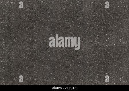 Texture et arrière-plan de la route asphaltée noire. Grain gris tarmac horizontal sur route asphaltée. Banque D'Images