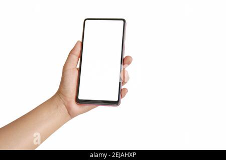 La main tient l'écran blanc, le téléphone portable est isolé sur un fond blanc. Banque D'Images