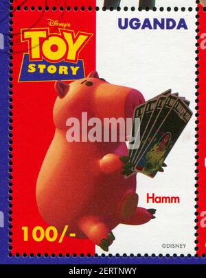 OUGANDA - VERS 1997 : timbre imprimé par l'Ouganda, montre Toy Story, Hamm, vers 1997. Banque D'Images