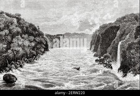 Le canot Lady Alice au milieu des cascades, en aval de Gamfue Bay, en Afrique centrale. Voyage à l'Afrique inexplorée, le continent mystérieux par Henry Morton Stanley. Ancienne illustration gravée du XIXe siècle, El Mundo Ilustrado 1881 Banque D'Images